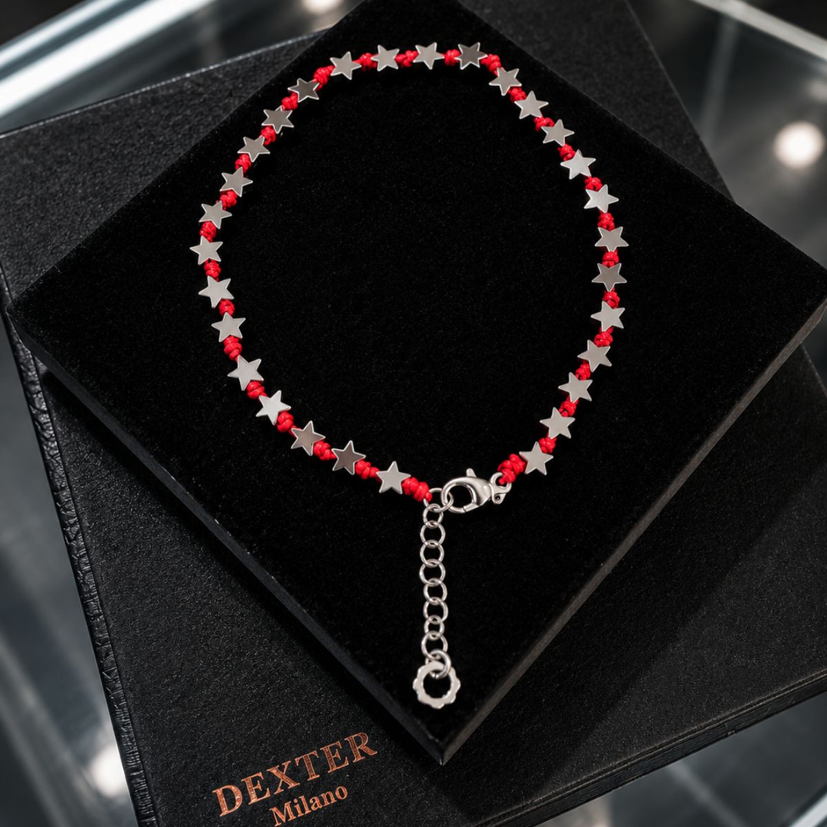 Cavigliera con pietra ematite a stella filo nautico rosso