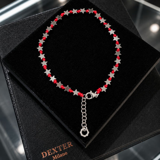 Cavigliera con pietra ematite a stella filo nautico rosso