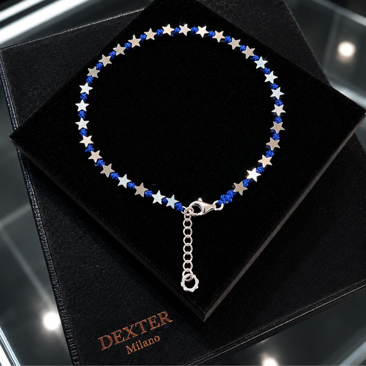 Cavigliera con pietra ematite a stella filo nautico blu