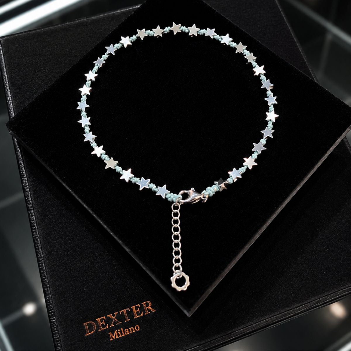 Cavigliera con pietra ematite a stella filo nautico azzurro